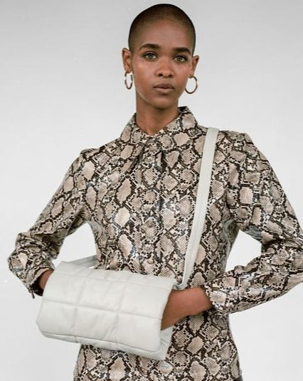CLYDE Muff Bag in Bone Lambskin. Available at EASE Toronto.