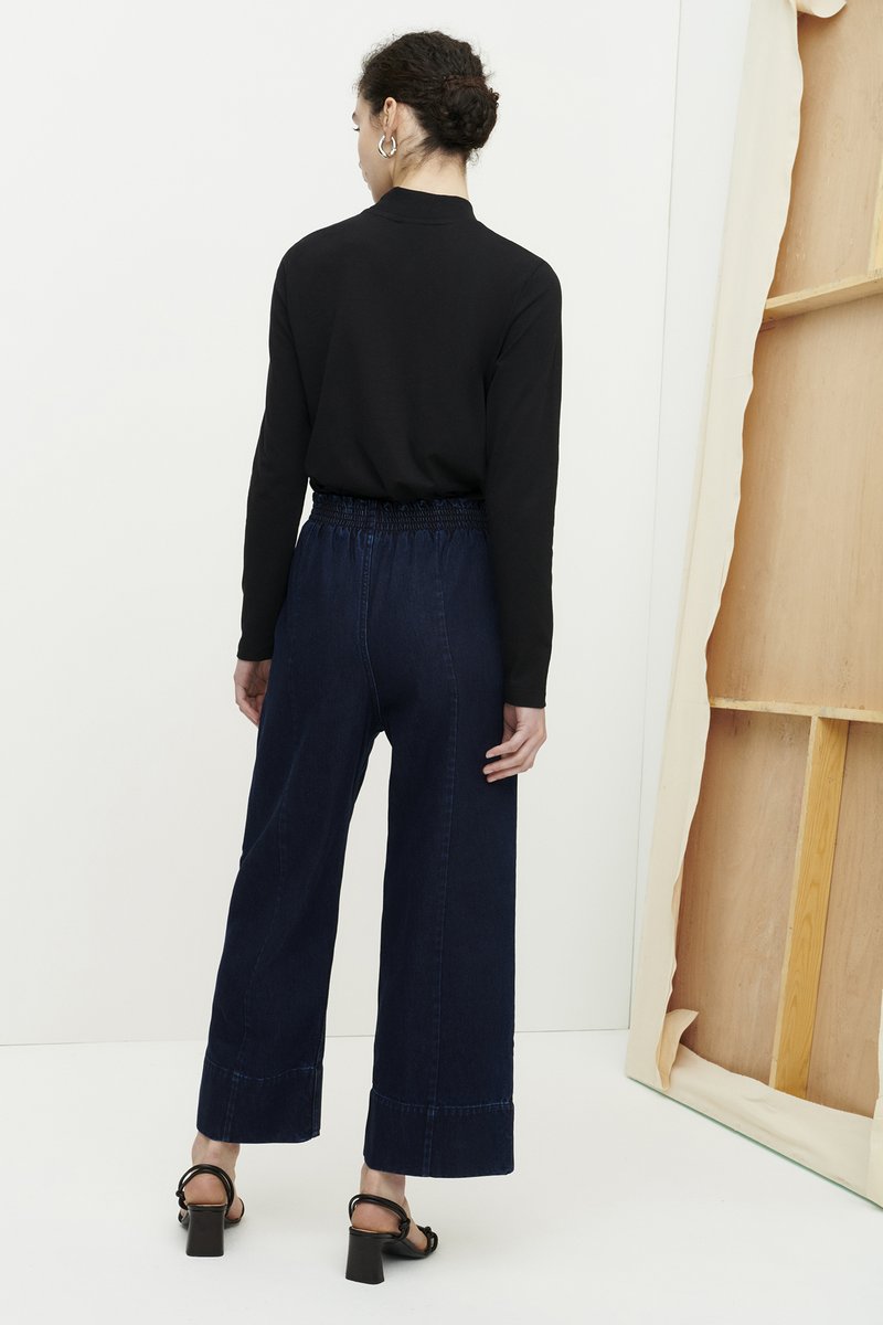 Kowtow High Neck Top in Black, back. Available at EASE Toronto.