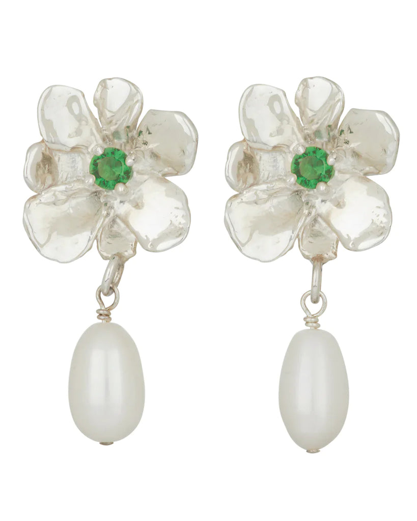 Pair of white bronze-plated earrings with a cultured pearl hanging from a flower, set with a green glass stone.