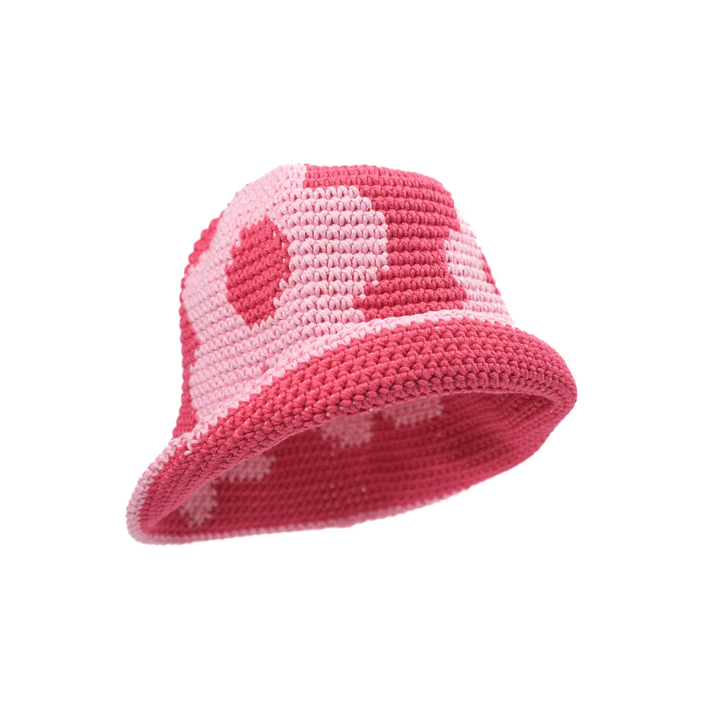 Crochet monochromatic pink bucket hat with graphic floral pattern available at Ease Toronto