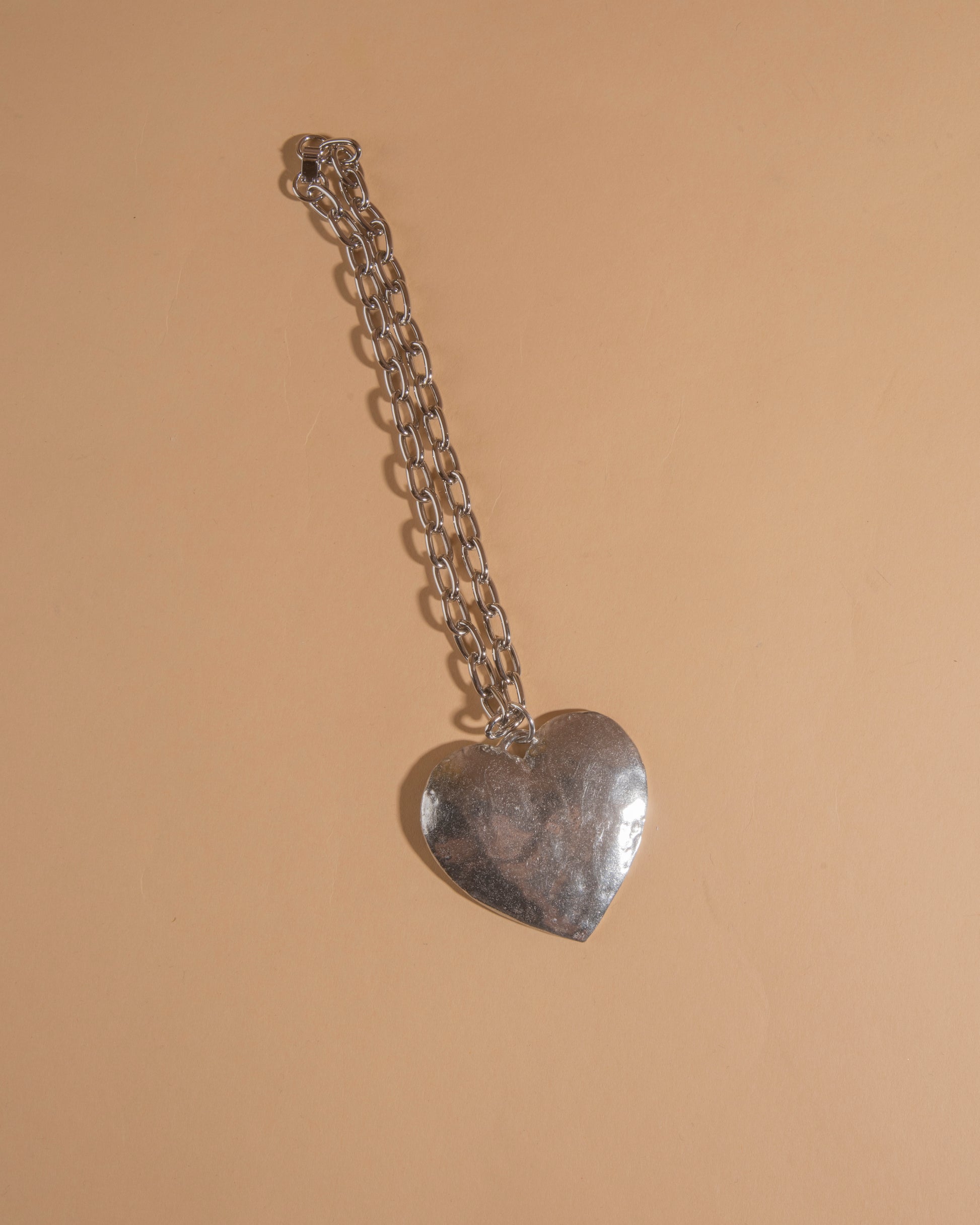 Silver-tone heart necklace on cable chain