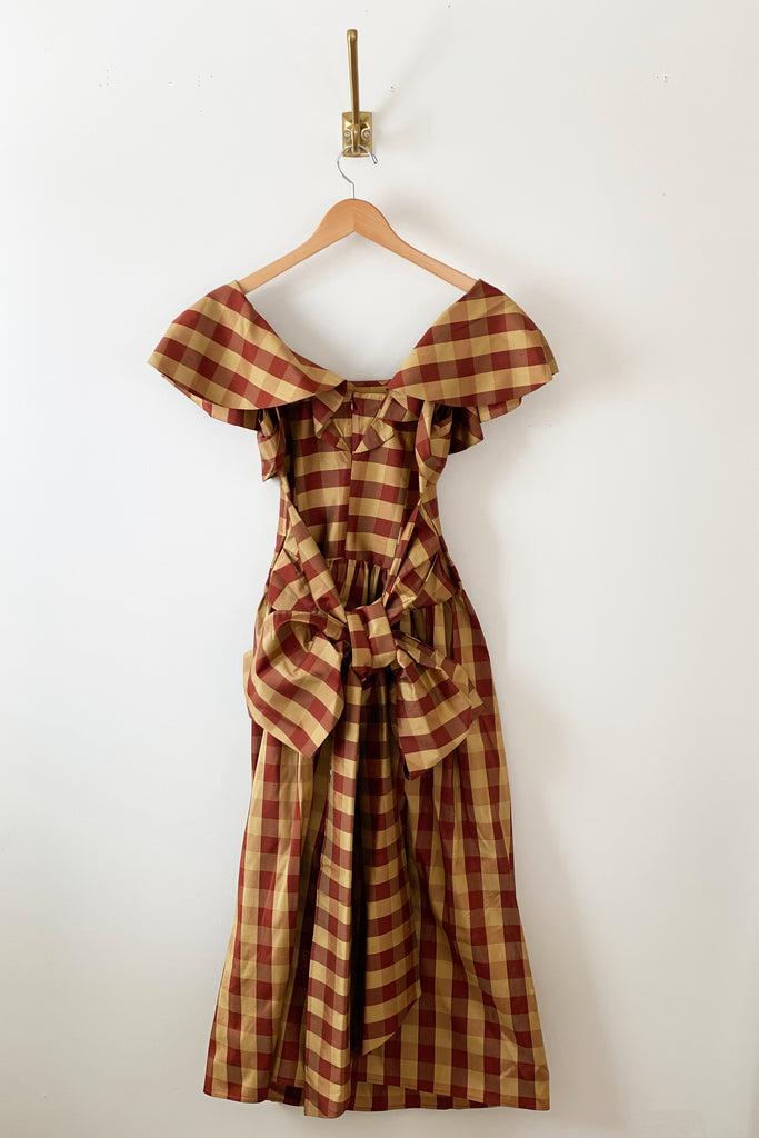 Batsheva Long Bow Dress in Sienna and Gold Check, back detail. Available at EASE Toronto. 
