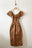 Batsheva Long Bow Dress in Sienna and Gold Check. Available at EASE Toronto. 