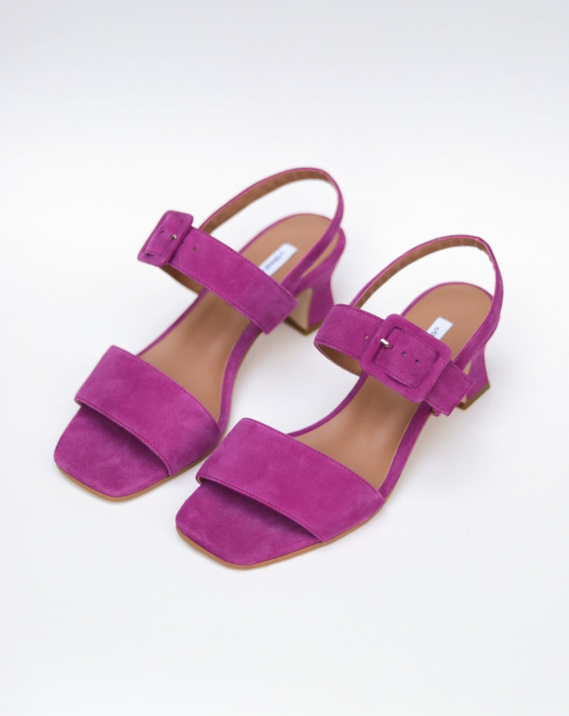 Fuchsia suede heeled sandals with buckle top strap  and fluted heel  available at Everything is Ease Toronto 