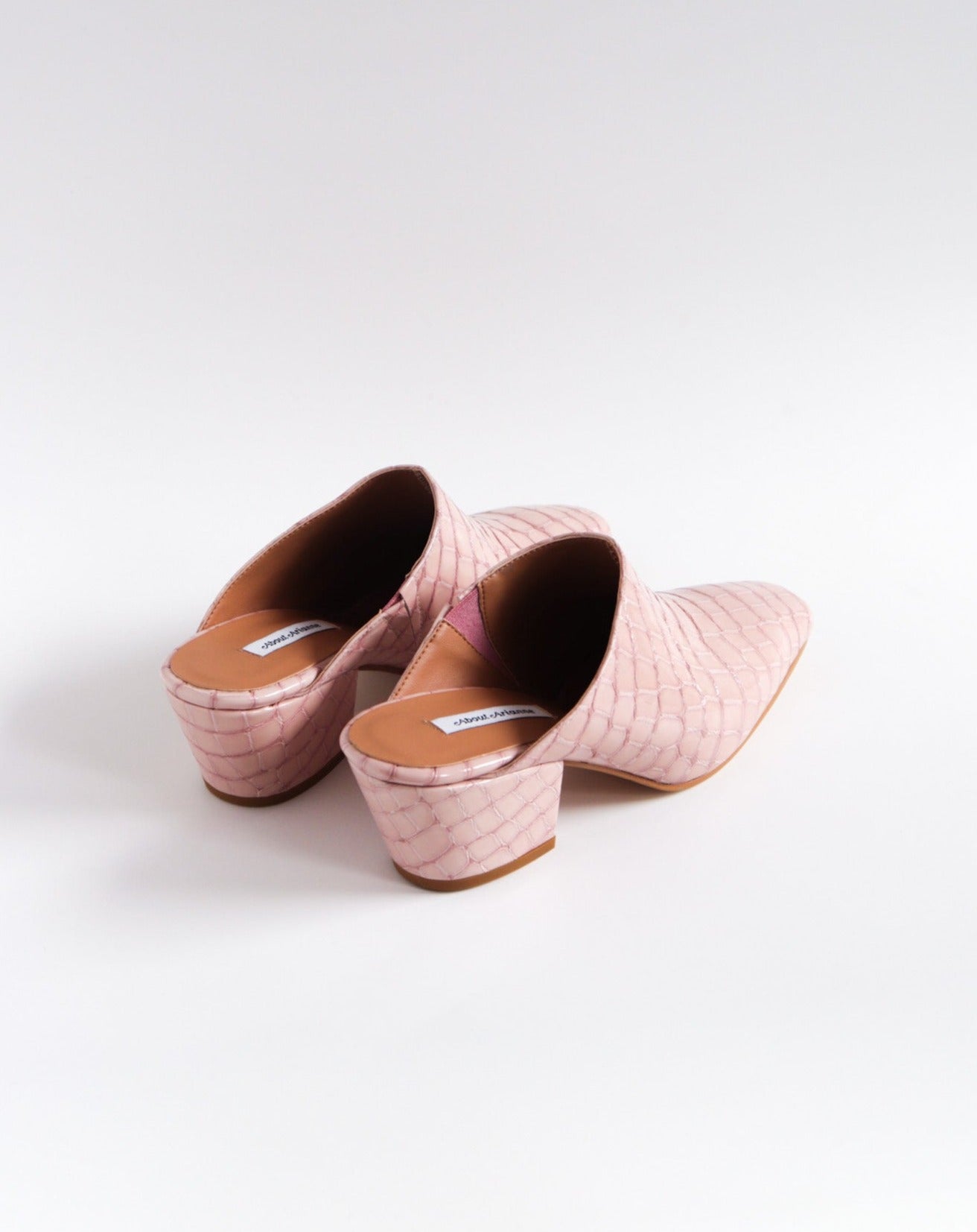 Pink 100% leather crocodile effect mules with almond shaped toe and block heel available at EASE Toronto