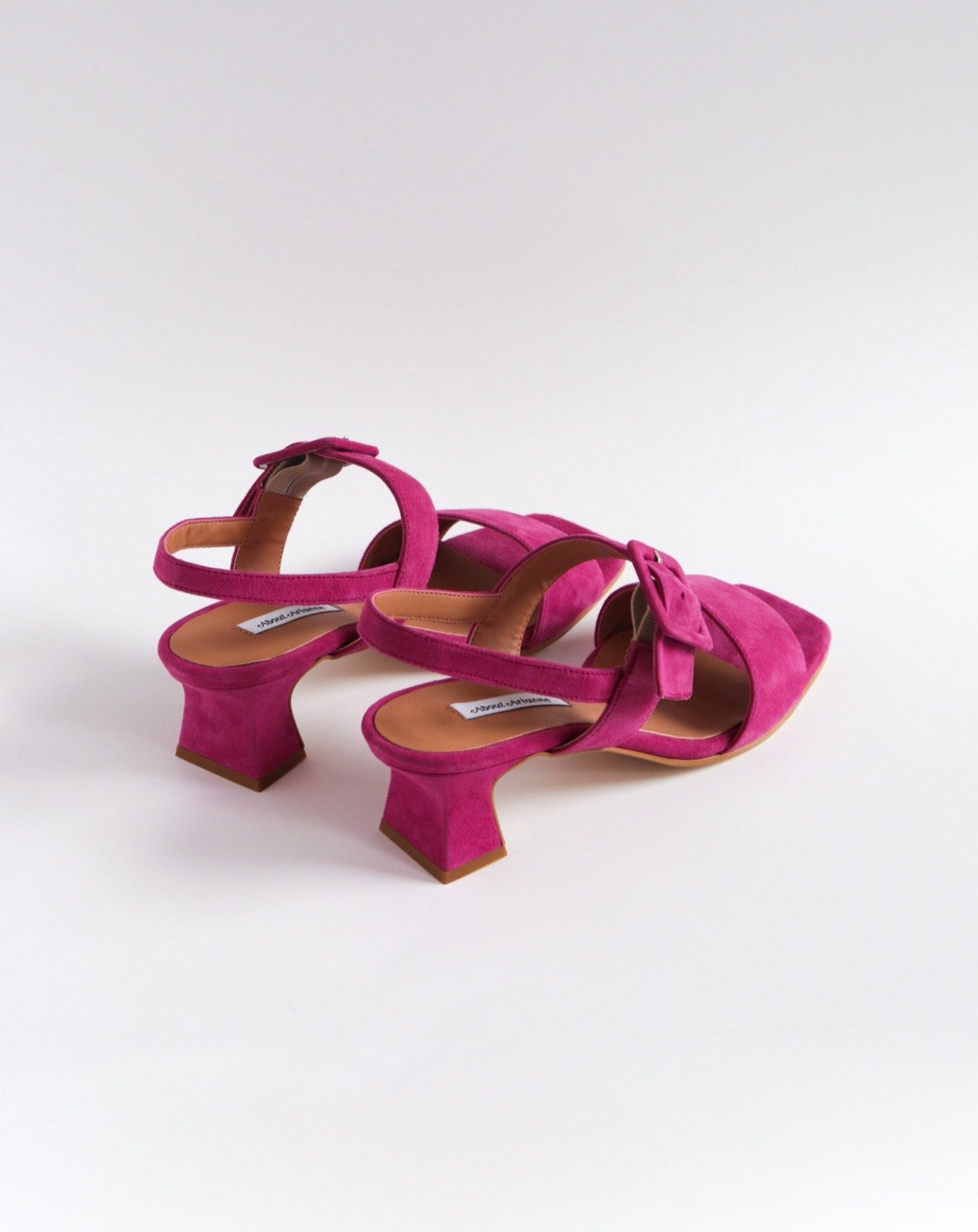 Fuchsia suede heeled sandals with buckle top strap  and fluted heel  available at Everything is Ease Toronto 