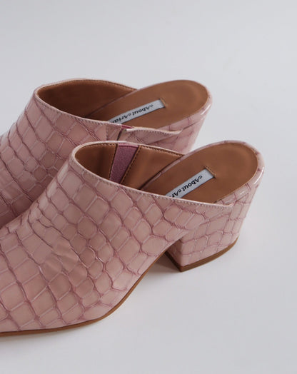 Pink 100% leather crocodile effect mules with almond shaped toe and block heel available at EASE Toronto