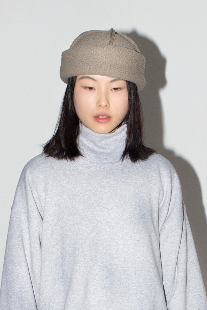 LLOYD Fleece Toque in Taupe. Available at EASE Toronto. 