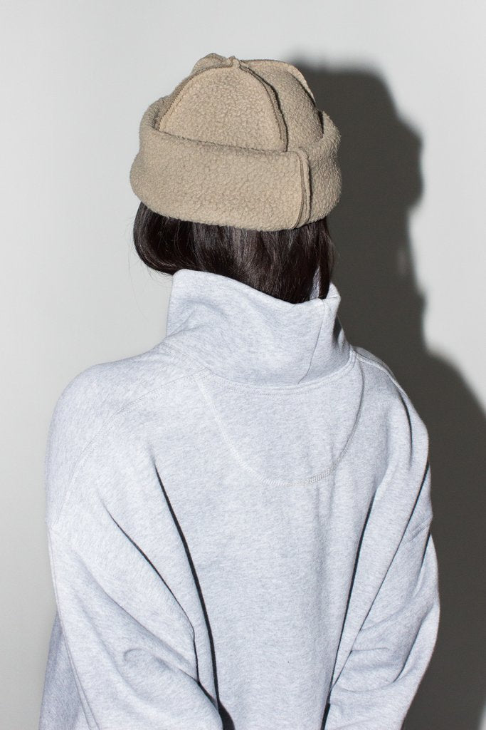 LLOYD Fleece Toque in Taupe. Available at EASE Toronto. 