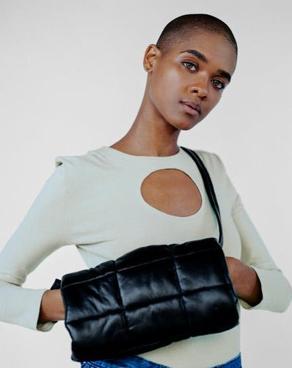 CLYDE Muff Bag in Black Lambskin. Available at EASE Toronto.