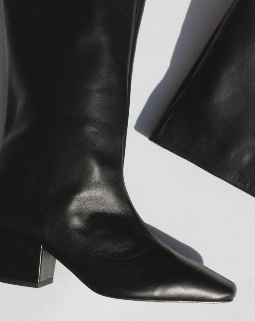 About Arianne tall pull on boot with pointed toe and chunky heel