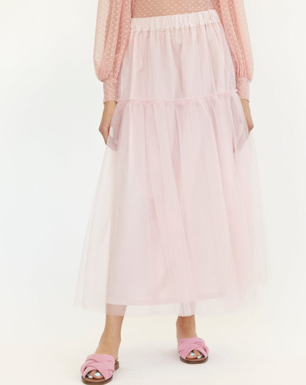 Ballet pink tulle skirt. Made up of two floating tulle  layers, the Tilly skirt has two tiers of gathered tulle, a stretchy elastic waistband, and is lined with a sturdy and soft cotton.  
