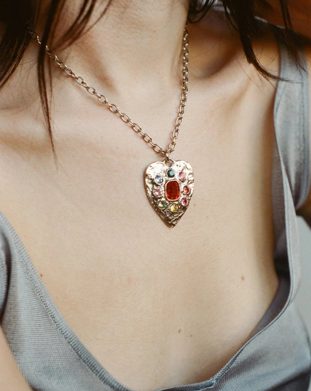 Silver-tone heart necklace with glass and crystal stones on cable chain. Charm Length: 1.5"