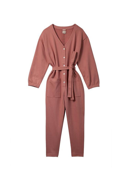 In Soft Focus Jogger Jumpsuit in Baked Coral. Available at EASE Toronto.